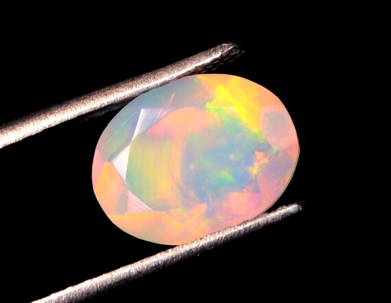 Ethiopian Welo Opal Gemstone: 1.40 CT Oval Faceted Opal, AAA Grade