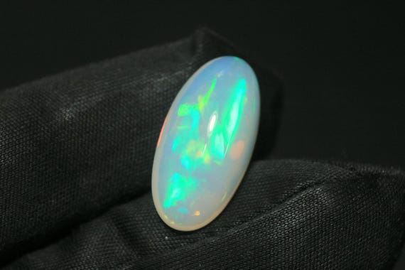 AAA Ethiopian Opal Cabochon: 6.60 CT Multi-Fire Oval Gemstone