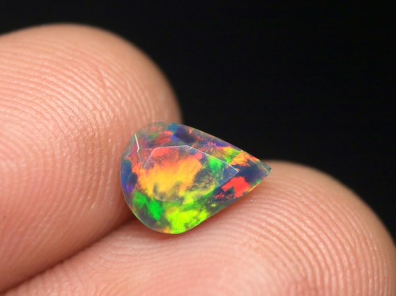 Pear Shape Black Opal Faceted Gemstone: 0.90 CT Ethiopian Welo Opal birthstone For Jewelry