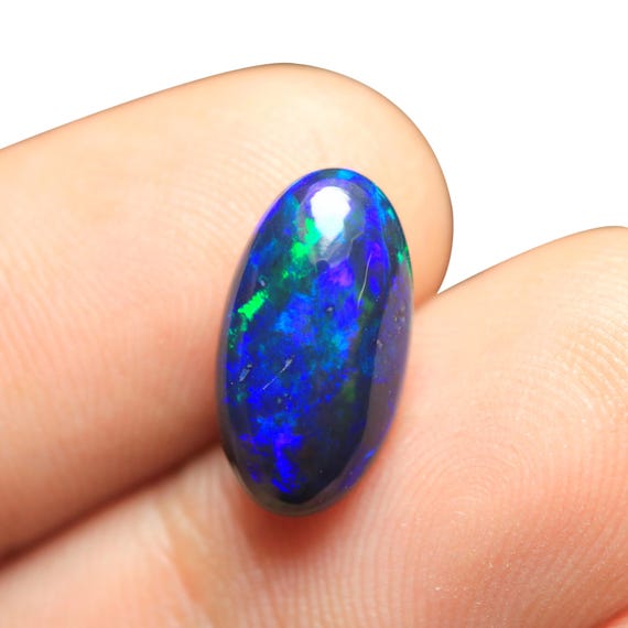 Welo Black Opal Cabochon: 2.80 CT Oval Ethiopian Gemstone (14.40x8x5 MM)