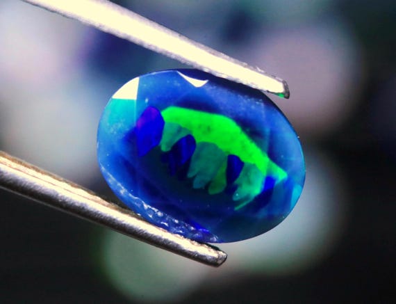 AAA Ethiopian Black Opal Gemstone: 1.10 CT Rainbow Welo Opal (9.40x7.40x4 MM)