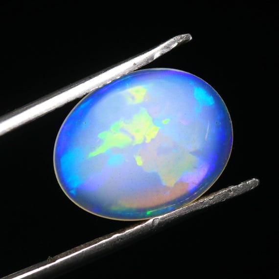 4.05 CT Welo Opal Cabochon: Oval White Ethiopian Gemstone, 15.10x12x4 MM