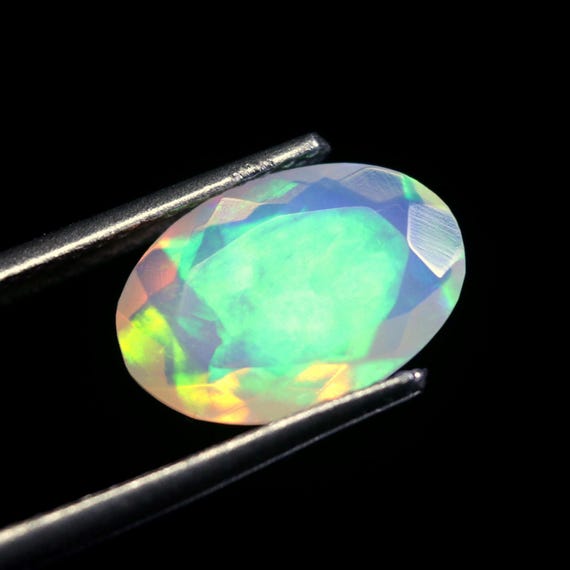Ethiopian Welo Opal: 1.50 CT Oval Faceted Loose Gemstone