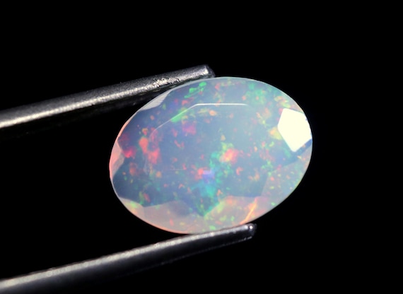 Ethiopian Welo Opal Gemstone: 1.10 CT Oval Faceted Galaxy Fire