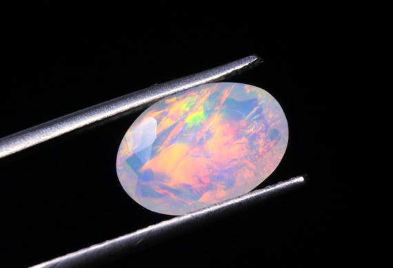 Natural Ethiopian Opal Gemstone: Oval Shape Multi Flashy Fire Welo Opal (1.70 CT)