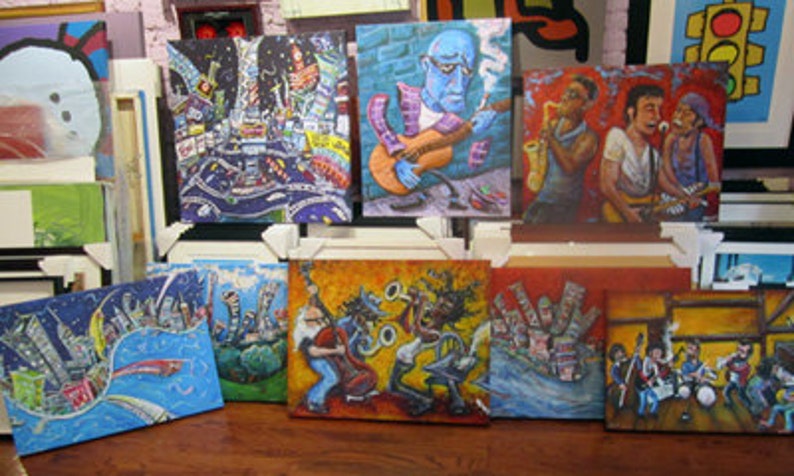 May include: A collection of framed paintings with various colorful abstract designs and cityscapes. Some paintings feature musicians playing instruments, while others depict abstract geometric shapes and patterns.