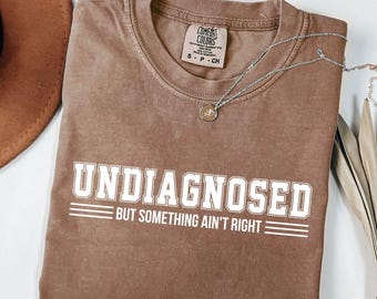 Undiagnosed But Something Ain’t Right Comfort Colors Shirt, Undiagnosed Shirt Funny Quote, Mental Health Humor Tee,Something Ain’t Right Tee
