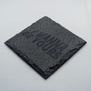 May include: Black slate coaster with the words "Be the reason someone smiles today" engraved in white.