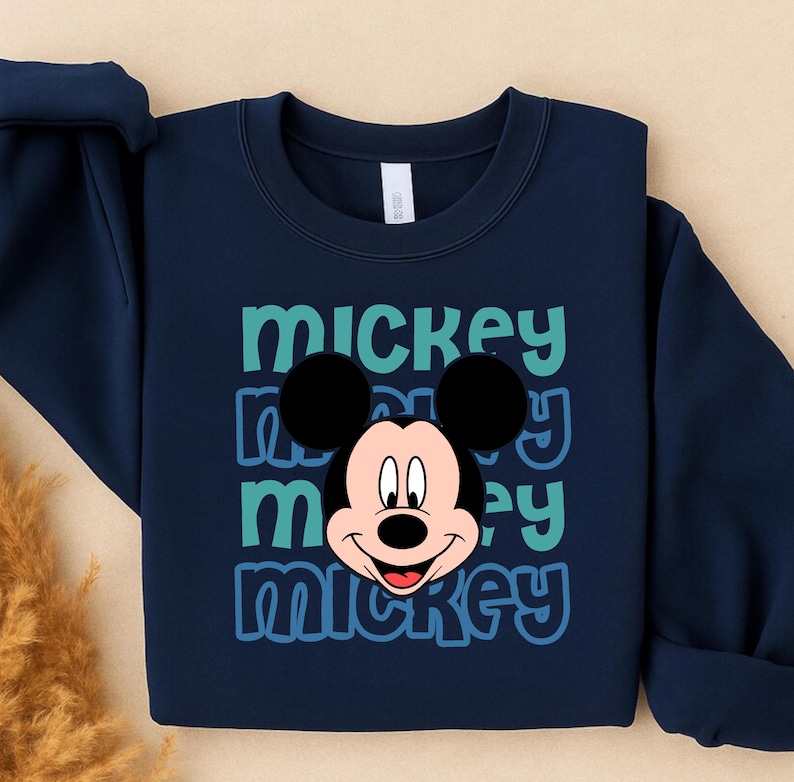 A navy blue sweatshirt with a large Mickey Mouse graphic printed on it.