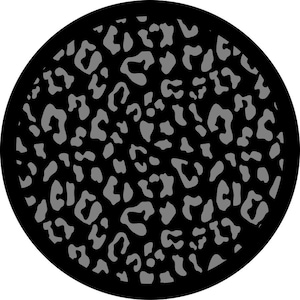 May include: Black and gray leopard print pattern on a round surface.