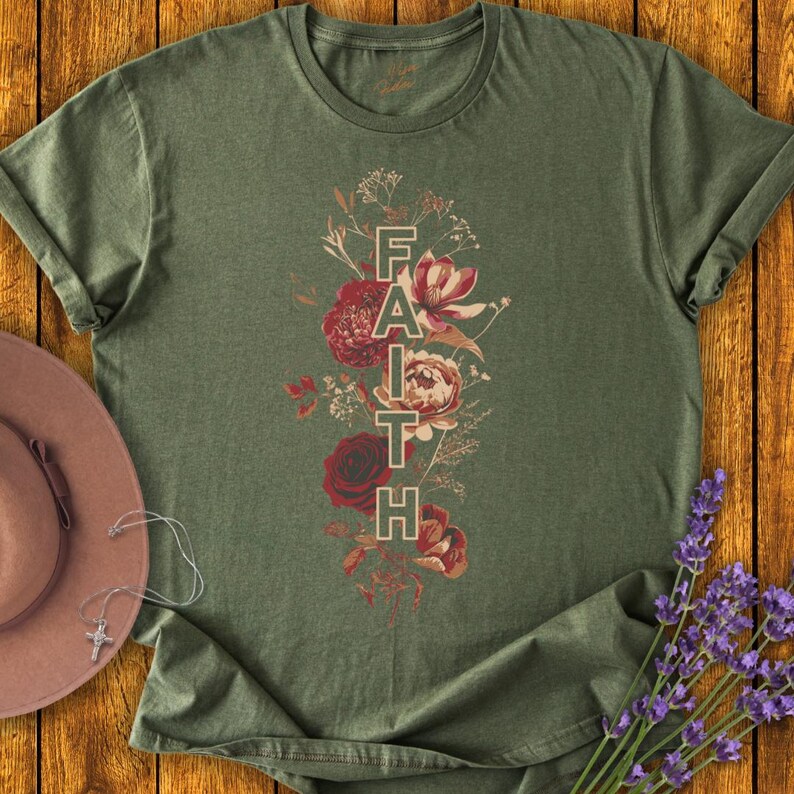 May include: A green t-shirt with a floral design and the word "FAITH" printed vertically in the center.
