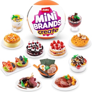 May include: A collection of miniature food items, including a cake, a strawberry shortcake, a bowl of ramen, a dessert, and a plate of food. The items are arranged on a white surface. The image also includes a large orange ball with the text "ZURU MINI BRANDS create" on it.