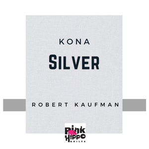 May include: Kona Silver fabric by Robert Kaufman, a light gray fabric with a subtle texture. The fabric is labeled with the Pink Hippo Quilts logo.