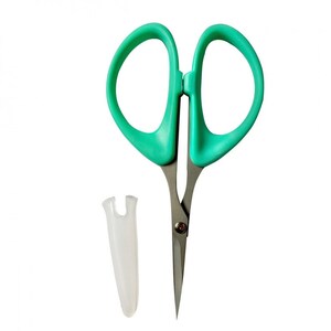 May include: A pair of small, green, metal scissors with a clear plastic sheath. The scissors have a pointed tip and a small, silver rivet in the center.