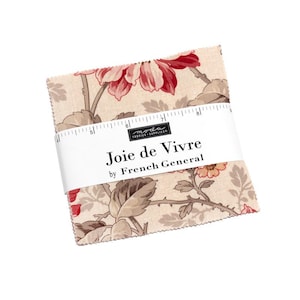 May include: A stack of fabric squares with a floral pattern in red, beige, and brown. The fabric is wrapped with a white band that reads "Joie de Vivre by French General."