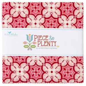 May include: A pink and red fabric square with a white and pink geometric pattern. The fabric is labeled "Piece & Plenty" by Lori Holt of Bee in My Bonnet.