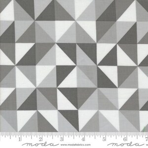 May include: White fabric with a geometric pattern of gray triangles. The fabric is a repeating pattern of triangles in various shades of gray.