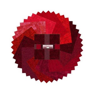 May include: A circular arrangement of red fabric squares in varying shades, from deep burgundy to bright crimson. The squares are arranged in a radial pattern, with a central square bundle labeled "Ruby Logs". The fabric appears textured.