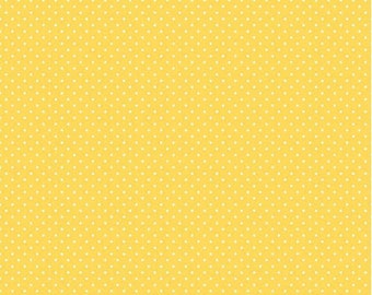 White Swiss Dot on Yellow background, a blender fabric from Riley Blake Designs,  sold by the Half Yard