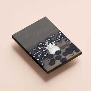 May include: A rectangular canvas print featuring a whimsical illustration. A white, round creature with outstretched arms is surrounded by numerous dark, fuzzy figures with white eyes. The background is a gradient of gray and brown.
