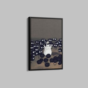 May include: Framed art print featuring a white cartoon character with arms raised, surrounded by numerous black, fuzzy creatures with large white eyes. The background is a muted gray, and the artwork is in a black frame.