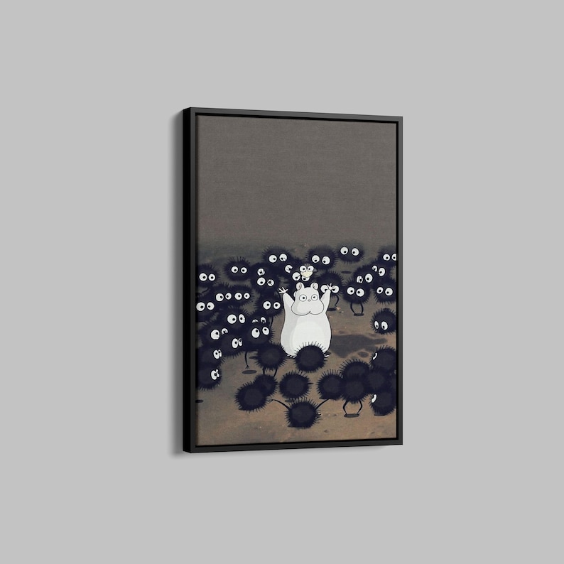 May include: Framed art print featuring a white cartoon character with arms raised, surrounded by numerous black, fuzzy creatures with large white eyes. The background is a muted gray, and the artwork is in a black frame.