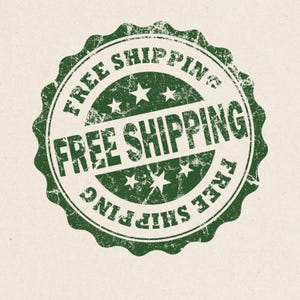 May include: A green, distressed stamp with the words "FREE SHIPPING" in a circular pattern. The text is repeated around the edge and in the center, with star accents. The stamp is on a beige background.