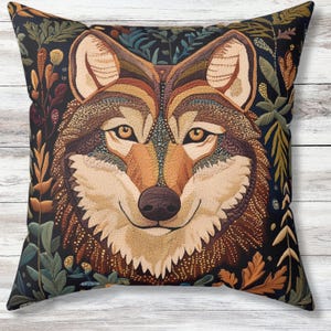 May include: Embroidered throw pillow featuring a detailed close-up of a wolf's face with a dark background and floral accents.