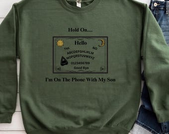 Ouija Board Sweatshirt, Hold On, Im On The Phone With My Son Ouija Board Crewneck Sweatshirt | Funny Spiritual Graphic  Unisex Heavy Blend