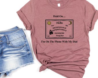 Ouija Board Sweatshirt, Hold On, Im On The Phone With My Dad Ouija Board Tshirt | Funny Spiritual Graphic Unisex Jersey Short Sleeve Tee