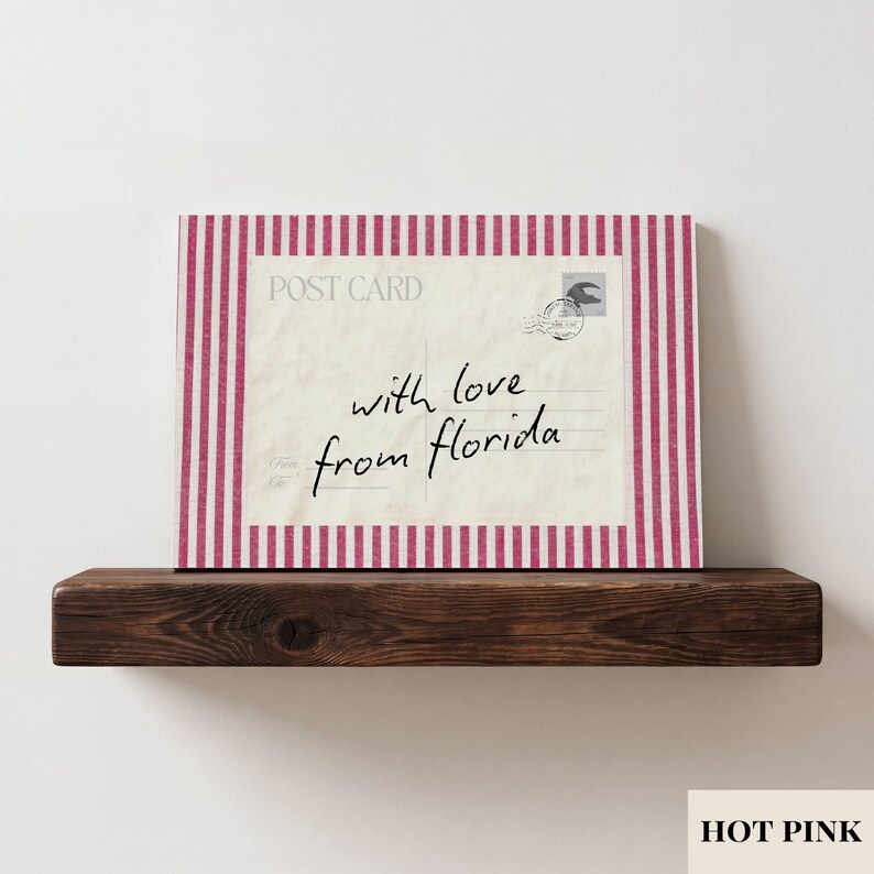 May include: A rectangular postcard print featuring a vintage-style cream background with the text POST CARD and a stamp graphic in the corner. The center displays the handwritten script with love from florida. It is framed by hot pink vertical stripes.