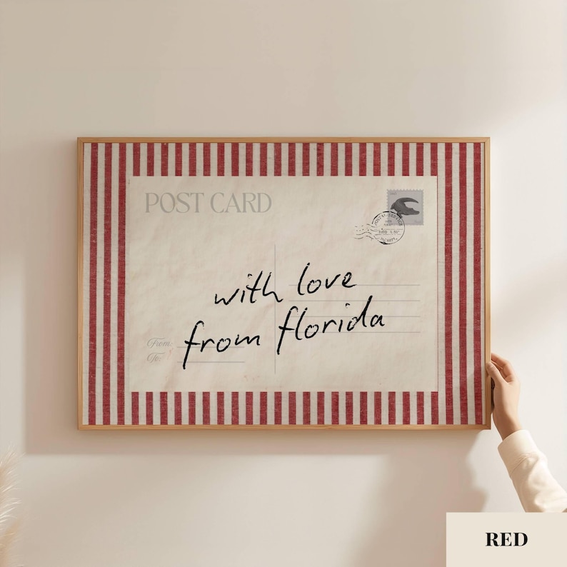 May include: A rectangular wall art print featuring a vintage postcard design with a cream-colored background and red vertical stripes along the border. The text reads POST CARD and with love from florida, accompanied by a circular postmark stamp.