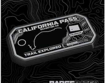 May include: A black and white badge with the text "CALIFORNIA PASS" and "SILVERTON, CO" above a map of the state of Colorado. The text "TRAIL EXPLORED" is below the map and the text "BADGERATED" is below that. The badge is on a black and white background.
