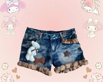 Blue denim shorts with faux fur trim and cute bow details