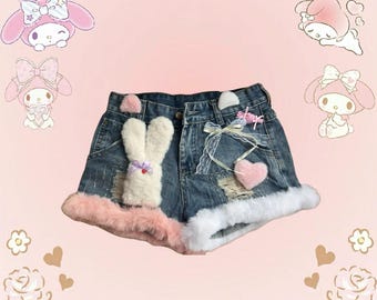 Cute denim shorts with pink fuzzy bunny ears and white faux fur trim