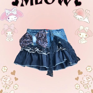 Blue denim mini skirt with a leopard bow and ruffle details