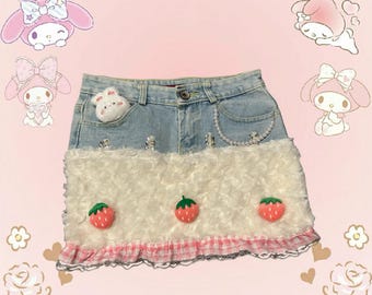 Adorable My Melody denim skirt with faux fur and strawberry patches - a stylish and kawaii design