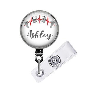 Retractable badge reel with design size choice 1¼ inch Plain extends to 34 inches