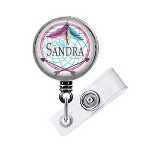 Retractable badge reel with design size choice 1¼ inch Plain extends to 34 inches