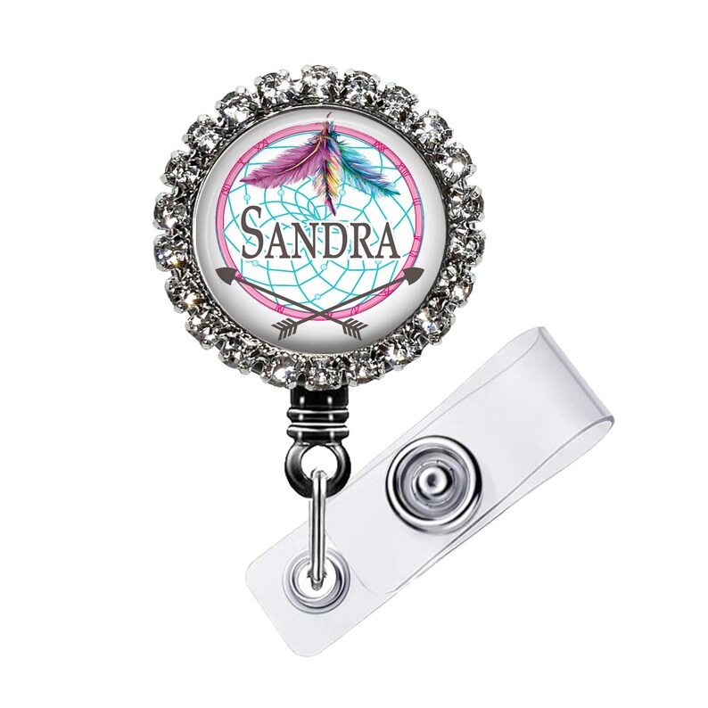 a badge with a picture of a feather on it