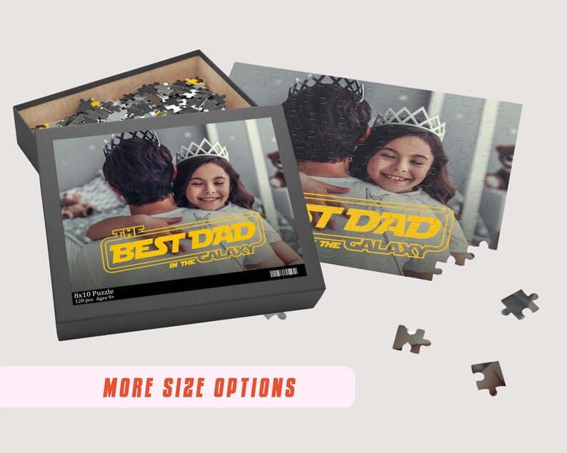 May include: A personalized 8x10 puzzle featuring a photo of a father and daughter with the text "The Best Dad in the Galaxy" in a yellow Star Wars-inspired font. The puzzle is in a black box with a white background.