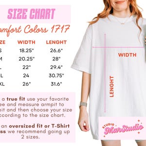 May include: A white Comfort Colors 1717 t-shirt with a size chart, including measurements in inches. The chart provides width and length for sizes S through 2XL. The text advises measuring armpit to armpit for a true fit.