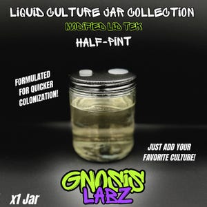 May include: A clear glass jar with a black lid and two small white circles on the lid. The jar is filled with a light yellow liquid. The jar is labeled "Liquid Culture Jar Collection Modified Lid Tek Half-Pint" and "Formulated for Quicker Colonization!" The jar is sitting on a black surface. The text "Just add your favorite culture!" is written below the jar. The text "GNOSIS LABZ" is written below the jar in green and purple letters. The text "x1 Jar" is written in the bottom left corner of the image.