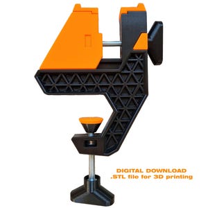 May include: A black and orange 3D-printed clamp with a screw mechanism. The clamp features a triangular pattern on the base and an orange top. The text "DIGITAL DOWNLOAD .STL file for 3D printing" is visible.
