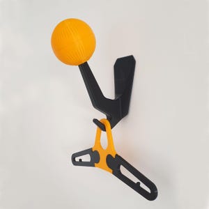 Motorcycle helmet holder with secret storage space
