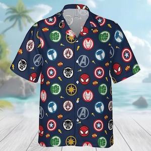May include: Navy blue short-sleeve button-down shirt featuring a repeating pattern of colorful superhero emblems. The design includes Captain America's shield, Iron Man's mask, Spider-Man's face, and the Hulk's fist. The word "BOOM" is also included.
