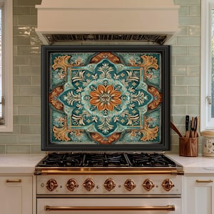 May include: A decorative kitchen backsplash with a teal, orange, and gold floral design. The backsplash is framed in black and mounted above a white stove with brass knobs. The kitchen features white cabinets and a window.