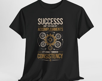 Motivational Tee - "Success Isn't Defined By Accomplishments, It's Built Through Consistency"