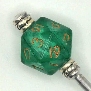 May include: A white ceramic mug with a black handle and the text "But First, Coffee" in a black, bold font. The mug is sitting on a wooden surface.