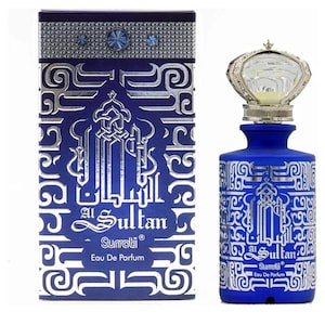 May include: A blue glass bottle of Al Sultan Surrati Eau De Parfum with a silver crown-shaped stopper. The bottle is decorated with silver Arabic calligraphy and the brand name.